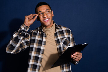 Poster - Photo of funky dreamy guy dressed plaid shirt signing contract looking emtpy space isolated blue color background