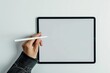 © Rawpixel.com - A hand holding a stylus on tablet technology creativity computer.