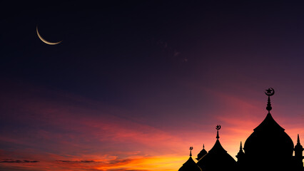 Wall Mural - silhouette dome mosques on dusk sky background with crescent moon after sun down evening and dark bl