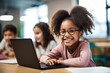 © Rawpixel.com - American girl kids sitting in font of laptop classroom computer looking.