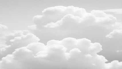 Wall Mural - White Clouds from above. Aerial view of the fluffy white cloud on blue sky. Top view from an airplane over white clouds