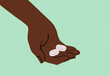 © Connect Images - Close-up of a hand holding two white pills against a teal background.