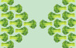 © Connect Images - Symmetrical kaleidoscope pattern of green vegetables on a pastel background