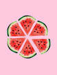 © Connect Images - Slices of watermelon arranged in a circular pattern on a pink background.