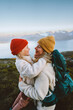 © EVERST - Mother hugging daughter child family hiking together travel outdoor active vacations in mountains of Norway parent and kid girl happy emotions backpacking trip