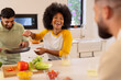 © wavebreak3 - Cooking together, diverse friends laughing and enjoying time in modern kitchen