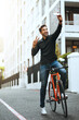 © BestCam/peopleimages.com - Man, happy and peace sign on bicycle with selfie in city for social media post and profile picture. Male person, outdoor and smile or satisfied in New York with memories, fun and interaction