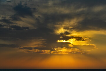 Russia, Dagestan. Panorama of the evening spring sky with multicolored clouds over the Caspian Sea.