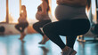 © Michael - Diverse pregnant women in gym class squatting, focusing on leg muscles for body wellbeing, promoting healthy active lifestyle during pregnancy