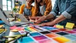 © Imagentive - Creative Team Discussing Color Palette in Design Studio Workspace.