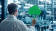 © Slowlifetrader - Back view of a warehouse supervisor interacting with a green virtual icon of a tree, representing smart logistics and digital warehouse management system.