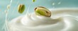 © labirint - Pistachio nut splashing into creamy yogurt