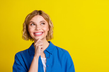 Poster - Portrait of pretty young lady look empty space wear blue shirt isolated on yellow color background