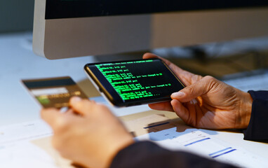 Business person, credit card and hand with phone and finance coding for cyber security in office. Paperwork, transaction check for code with protection and bills information for identity theft