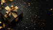 © sablengjago - Black gift box with gold ribbon and confetti on black background.