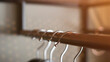 © SIV Stock Studio - Close-up on clothes hangers. Fashion and shopping concept.