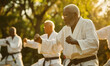 © goami - senior old man in kimono practicing martial arts at green park, active older male has karate or judo training outdoor at sunset