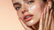 © paco - Close-Up of Woman Applying Hydrating Cream on Face. A close-up image of a young woman with dewy skin, gently applying hydrating cream on her face.