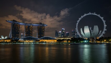 Canvas Print - Night view of Singapore skyline with Ferris wheel and Marina Bay Sands reflecting on water.