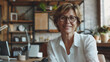 © Mahemud - Smiling mature businesswoman working at office