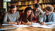 © Matilda - Multicultural Group of Engrossed Students Studying Together in a Library