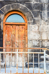 Canvas Print - shabby orange painted wooden door in Gyumri