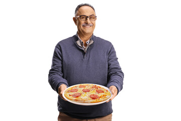 Mature man holding a pepperoni pizza on a plate