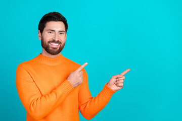 Poster - Photo of handsome nice man wear orange stylish clothes recommend empty space isolated on cyan color background