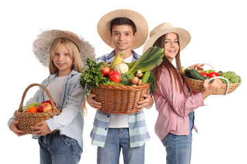 Little farmers with fresh food on white background