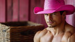 © Mr. B - Bad Cowboy in Pink Tones - Adding a Sexy and Edgy Flair to the Wild West Aesthetic with Bold Pink Tones, Copy space	Man in a pink cowboy hat leans against a wall.