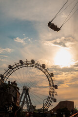 Vienna's Wiener Riesenrad at sunset: Iconic Prater ferris wheel silhouette against dramatic sky