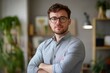© Dzikrul Husnani - Portrait, glasses and business man with arms crossed in startup office for pride in career or job. Creative, face and confident professional entrepreneur, copywriter and employee coworking , ai