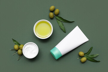 Wall Mural - Composition with natural cream, green olives and oil on color background