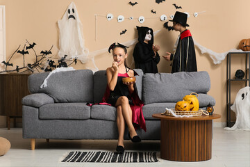 Poster - Teenage girl dressed for Halloween eating candy and her friends at party