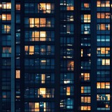 Seamless pattern of skycraper or office building windows at night - tiles, texture