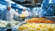 © pornthip - Chefs Preparing Food in Commercial Kitchen with Trays of Mashed Potatoes  Rice  and Tomatoes