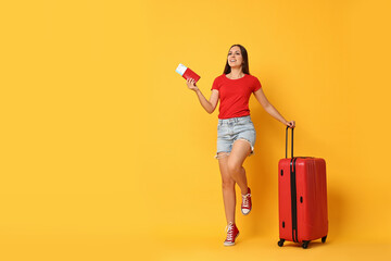 Sticker - Happy young woman with suitcase, passport and ticket on orange background, space for text