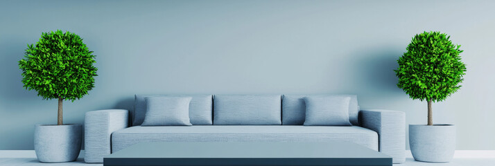 A modern living room with a plush gray sofa, two potted plants, and a low coffee table.