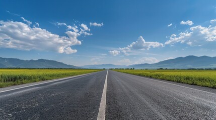 Sticker - Asphalt Road Leading to Mountains Under a Blue Sky