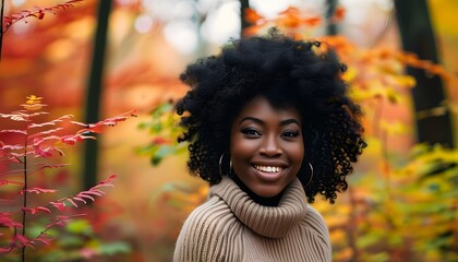 Wall Mural - Joyful serenity of an African American woman amidst the vibrant colors of an autumn forest, celebrating the beauty of nature and the seasonal landscape