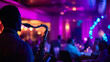 © Agata25 - Saxophonist performing at jazz lounge with elegant audience and vibrant lighting