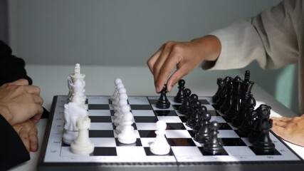 two business women play a game of chess to be a concept of business competition and problem solving 