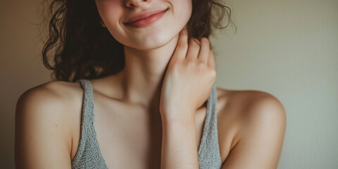 Wall Mural - Close up of a woman in a grey tank top holding her shoulder with one hand, generative AI