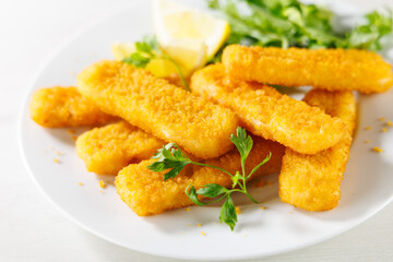 Canvas Print - fish fingers sticks with salad and lemon