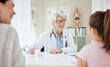© peopleimages.com - Checkup, doctor and talking to child, smile and mature woman with question, growth and development. Office, mom and daughter in appointment, writing and conversation for health of kid or pediatrician