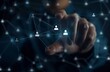 © Rahmat - Businessman touching virtual icons of a customer network and human resources for a business group, in the style of a touch screen on a dark background with a blur effect