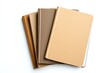 © padungsak - A collection of simple, elegant notebooks in neutral tones, perfect for writing, journaling, or note-taking in any setting.