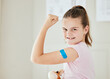 © Flashizzle/peopleimages.com - Girl, kid and hospital plaster in portrait, vaccine injection and bandage for virus treatment. Female person, bicep flex and bandaid for immunization booster, clinic and flu shot for empowerment