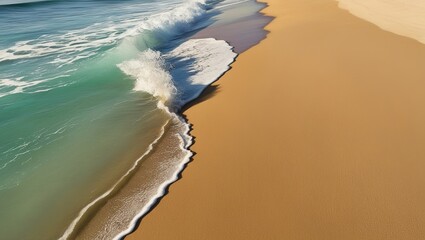 Wall Mural - The seascape has white foamy waves scattered on the sandy beach under a clear blue sky.