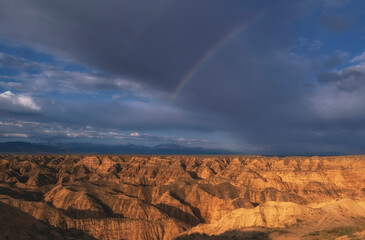 The Yellow Canyon is also called the lunar canyon in Kazakhstan near the Charyn River with a rainbow in the sky